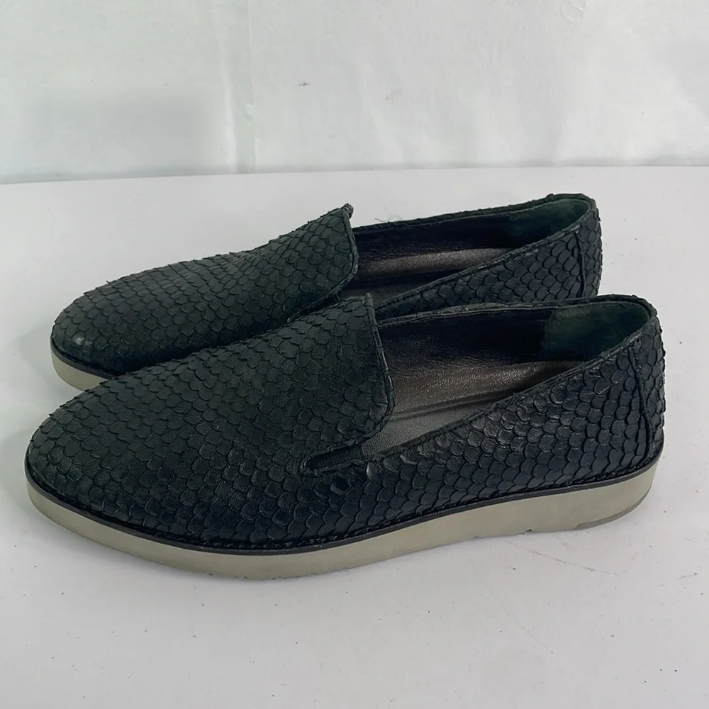 Johnston and Murphy, 781-1545. Texturized black leather loafers with gray soles.